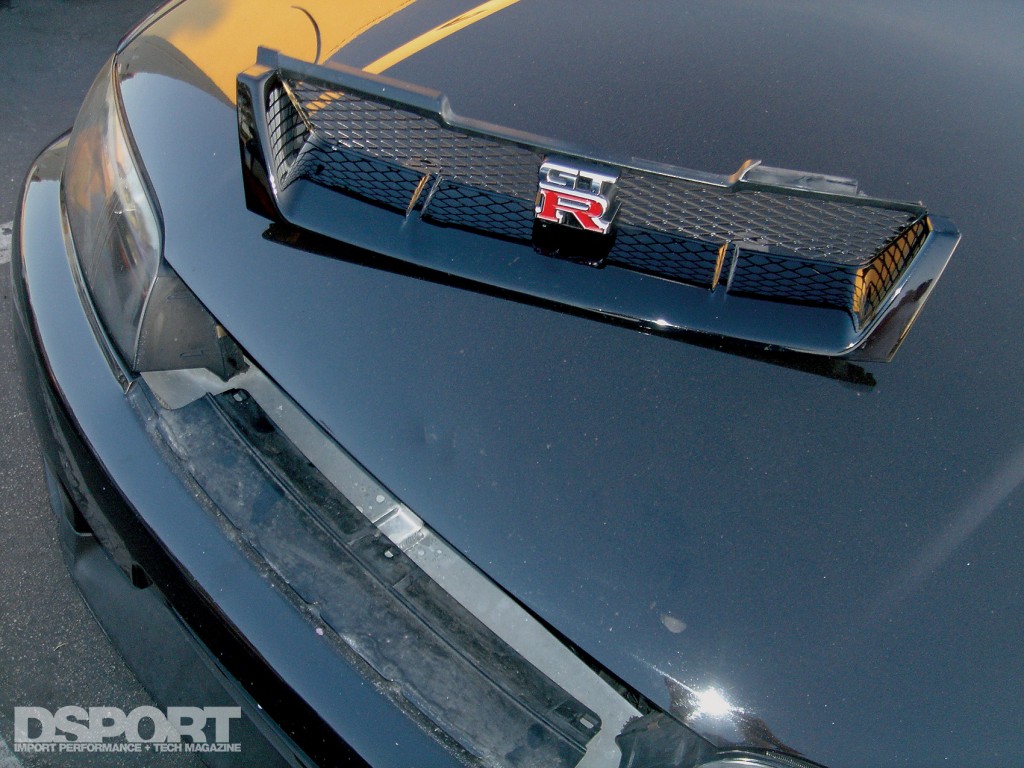 GT-R grill and damage it caused when it flew off at over 100 MPH