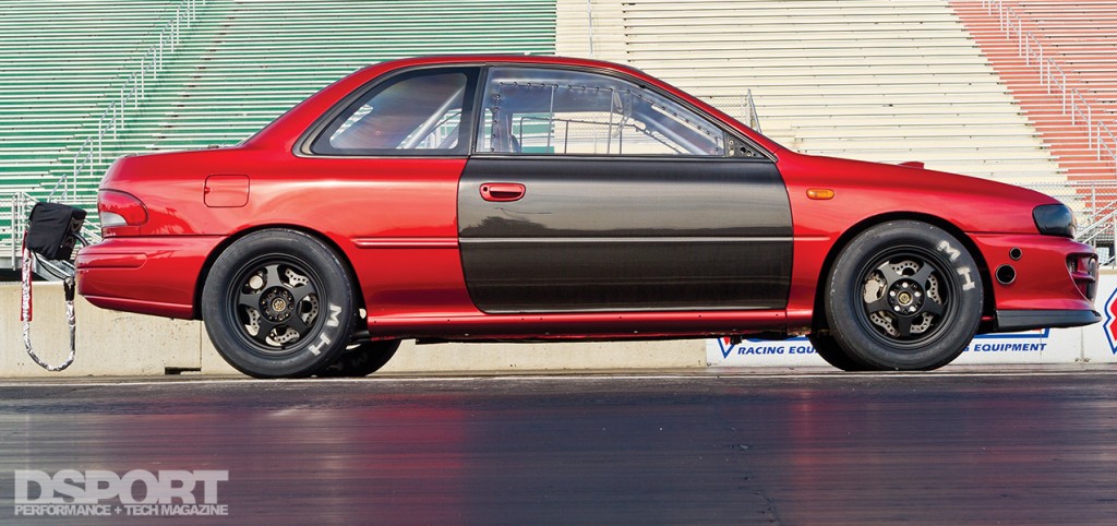 Side profile of the Subaru Impreza RS at the track