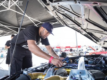 Jeren walker working on the D'Garage R33 in the pits