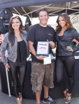 Instafame car show winner takes a picture with models