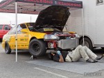 Drag racer working on his car in the pits